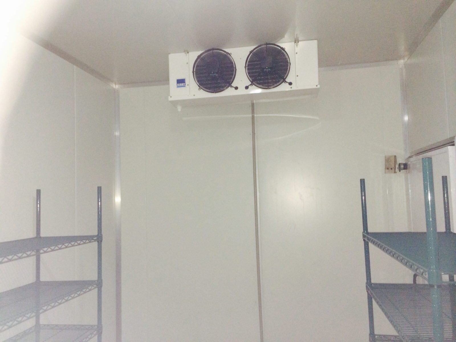 Interior of a commercial cool room with overhead evaporator